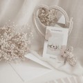 Bon podarunkowy - 500 zł Zbliżenie na złote zdobienie na białym produkcie porcelanowym Bon podarunkowy - 500 zł nadzwyczajnie.mom