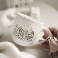 Kubek 300 ml - Zimowe domki ZŁOTE ZDOBIENIA Biały kubek porcelanowy nadzwyczajnie.mom ze złotym zdobieniem i napisem Zimowe domki ZŁOTE ZDOBIENIA — 300 ml